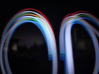 light painting Photography, long exposure, ripple curve and circle against black background