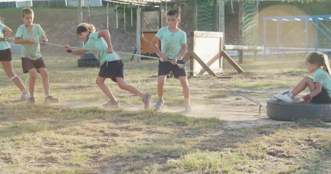 Group of Caucasian children training at boot camp 