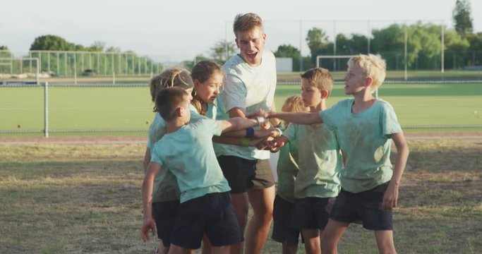 Group of Caucasian boys and girls at boot camp together