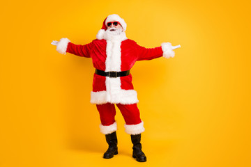 Fototapeta na wymiar Full length body size view of his he nice funny cheerful cheery glad white-haired Santa dancing having fun rest chill out party isolated bright vivid shine vibrant yellow color background