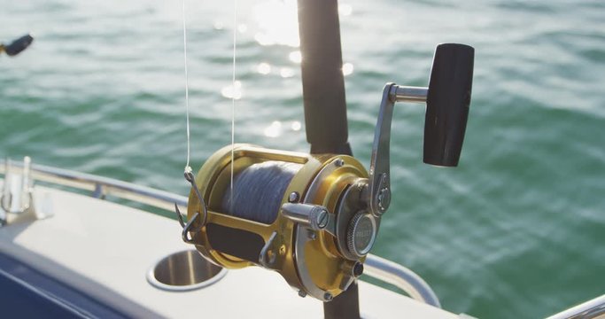 Close up detail of a fishing rod standing up on a boat