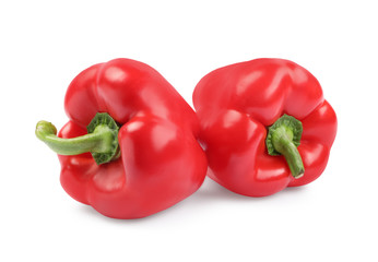 Ripe red bell peppers isolated on white