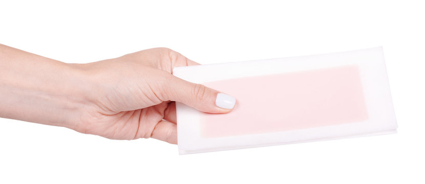 Hand With Paper Wax Strip For Hair Removal, Isolated On White Background.