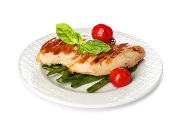 Tasty grilled chicken fillet with green basil, beans and tomatoes isolated on white