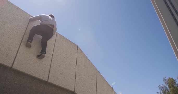 Caucasian man practicing parkour