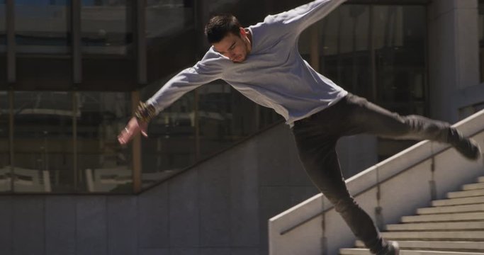 Caucasian man practicing parkour