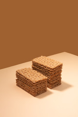 Crispbread on a beige surface, isometric creative minimalism concept