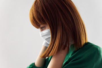 Fototapeta premium Woman in fashion dress posing in medical mask virus covid-19