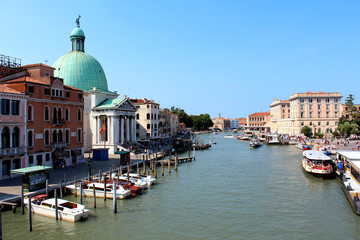 Fototapeta na wymiar Panoramic view of the Grand Canal in Venice, Italy. Beautiful summer day with clear blue sky.