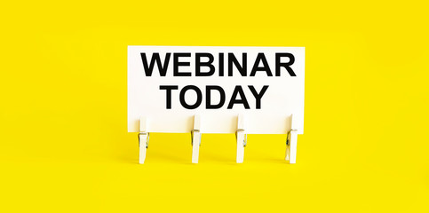 WEBINAR TODAY , written on white sticky note on yellow background