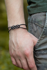 leather bracelet on man hand