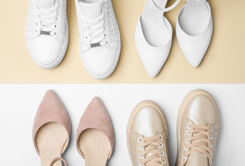Stylish female shoes and sneakers on color background, flat lay