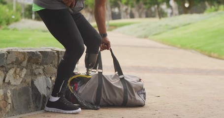 Side view man with prosthetic leg walking - Powered by Adobe