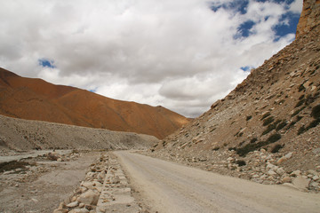 View of the mountains and stream of melting snow from Everest on the way to Everest Base Camp,...