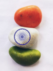 Concept of Indian flag with colurful stones on white background