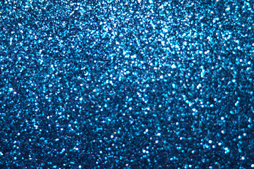 Obraz premium blue Sparkling Lights Festive background with texture. Abstract Christmas twinkled bright bokeh defocused and Falling stars. Winter Card or invitation 