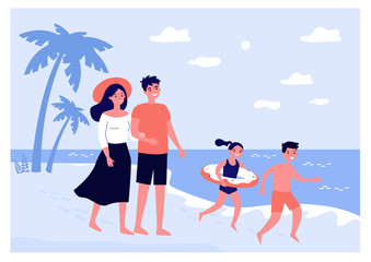 Happy parents couple and kids spending summer vacation by seaside. Family with children in swimsuits walking on sea beach. For travel, leisure time, outdoor activity, holiday concept