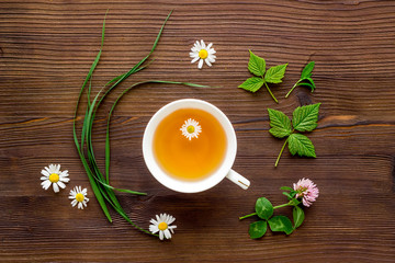 Herbal tea - green herbs and wild flowers, top view