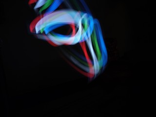 light painting Photography, long exposure, ripple curve and circle against black background