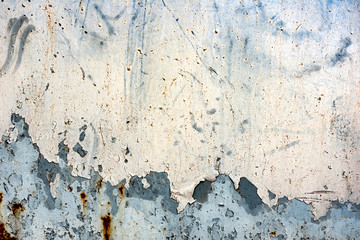 Texture of a metal wall with cracks and scratches which can be used as a background