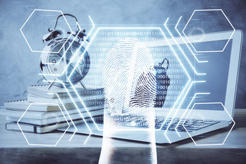 Computer on desktop in office with finger print drawing. Double exposure. Concept of business data security.