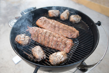 Pork ribs baked to a crisp on a smoky gril
