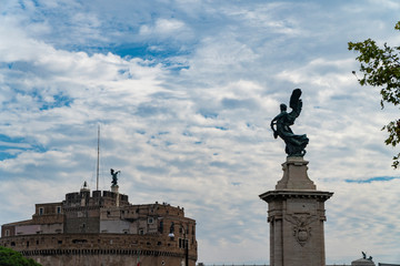 Angel on guard of Rome, statue of an angel on the background Castle Sant'Angelo, Rome, Italy