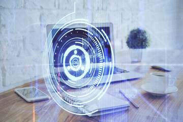 Double exposure of laptop computer and technology theme hologram. Concept of freelance work.