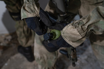 Close-up grenade in the hands of an airsoft player
