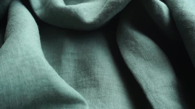Linen fabric background. Linen textile cloth with fabric texture and pattern. Production of clothing and natural environmentally friendly materials.