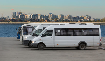 Buses at the bus station on the background of the city