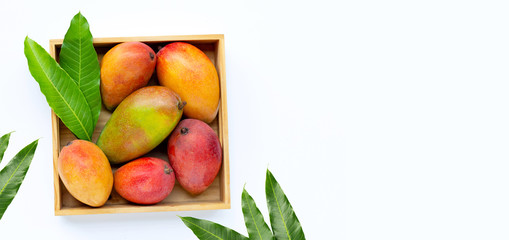 Tropical fruit, Mango  in wooden box on white background.