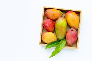 Tropical fruit, Mango  in wooden box on white background.