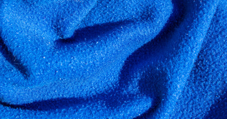 Fototapeta na wymiar creased blue cotton fabric. background