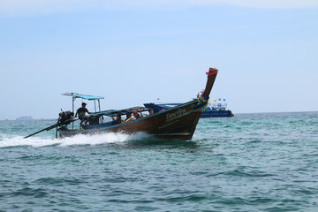 PHI PHI ISLAND, THAILAND - Feb 15, 2020: Tourist having a longtail boat tour from Phi Phi to Maya...