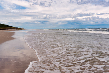 Scenic view of Baltic Sea white sand beach. Beautiful sea landscape in Poland.