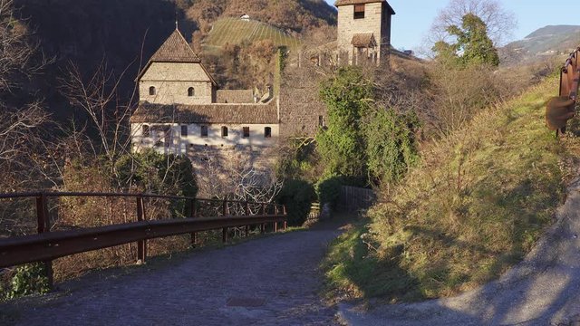 Tilting reveal of Runkelstein castle, a historic medieval fortress in Bolzano Bozen. Alps, Italy