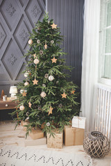 Fototapeta na wymiar Christmas tree background. Closeup still of spurs with handmade decor. New year interior