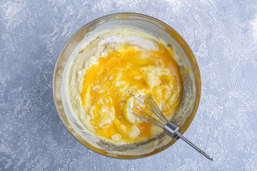 Step by step recipe. Cooking pie or semolina cake. Step 5 Put on two eggs and sugar into dough and mix with whisk. Homemade food concept.