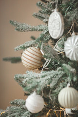 Christmas tree background. Closeup still of spurs with handmade decor. New year interior