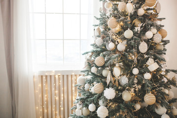 Christmas tree background. Closeup still of spurs with handmade decor. New year interior