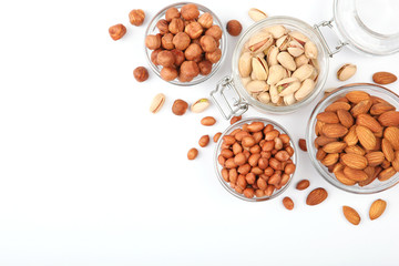 Obraz na płótnie Canvas Set of different nuts on a light background. 