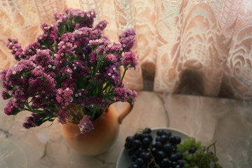 Fototapeta na wymiar bouquet of purple wildflowers in a jug close up