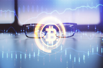 Obraz premium Crypto theme hologram with glasses on the table background. Concept of blockchain. Double exposure.