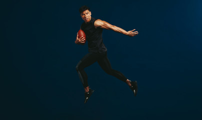 Fototapeta na wymiar American football player in action