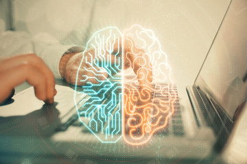 Man typing on keyboard background with brain hologram. Concept of big Data.