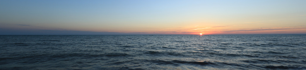 colorful sea sunset and orange sun