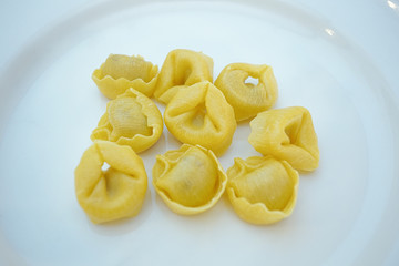 Italian traditional tortellini pasta over white plate. Healthy diet. Mediterranean cuisine.