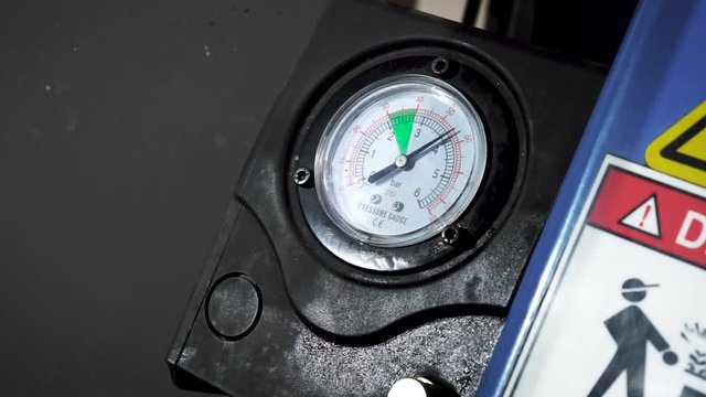 Pressure gauge in auto service station, arrow movement on an industrial pressure gauge. Footage. High Precision Industrial Differential Pressure Gauge. Vacuum Gauge device.