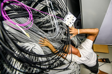 The man became entangled in a large number of electrical and network cables connected to each other...